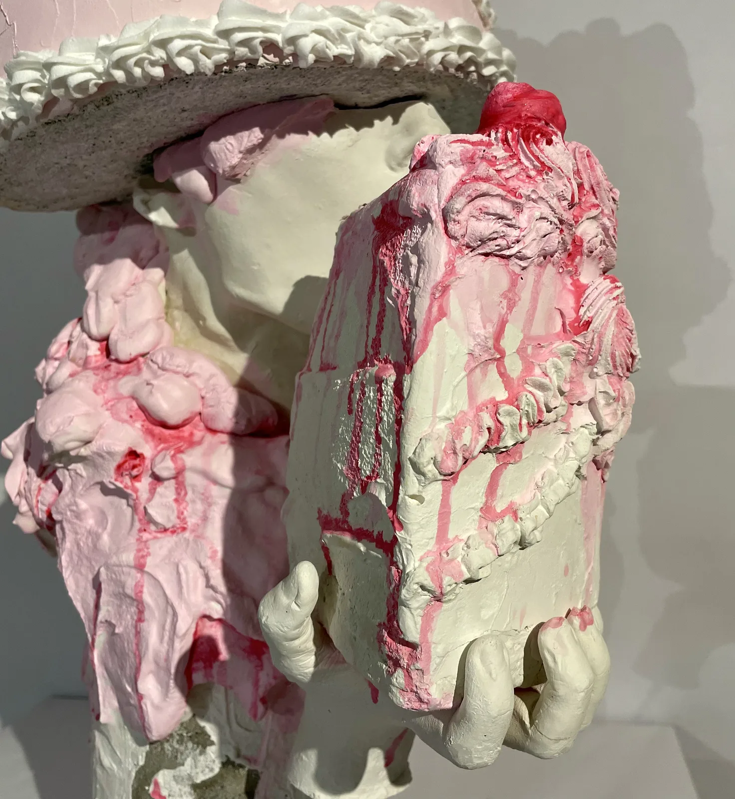 Close-up detail of the Eucharist sculpture revealing surface texture and material